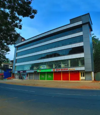 a building on the side of a street at karibu Residency in Malappuram
