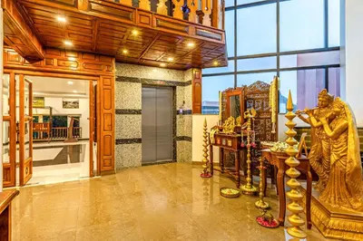 a room with a statue of a woman at Sterling Darshan Guruvayur in Guruvāyūr