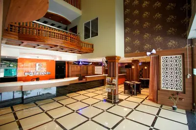a lobby of a shopping mall with a counter at Builda Park inn in Ottappālam