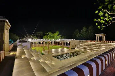 an empty amphitheater at night with a park at My Village - Eco Rural Resort in Coimbatore