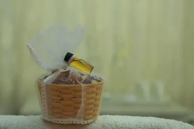 a bottle of perfume in a wicker basket at Grassroots Wayanad, Valley-view Tents in Vythiri
