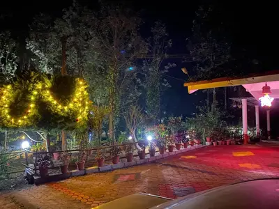 a night view of a park with christmas lights at LAZY DAYS Wayanad in Cherambādi