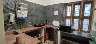 a bathroom with a sink and a bath tub at Garden House in Mysore