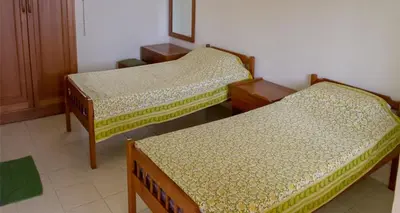 a room with three beds in a room at Camellia Heights 1&2 in Coonoor