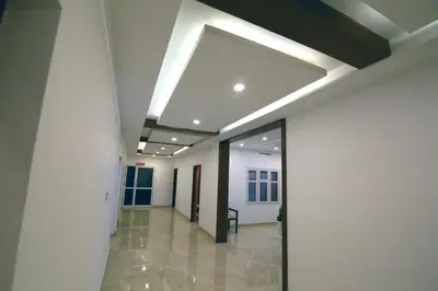 a hallway of an office building with a ceiling at Gateway Airport Hotel in Kannur