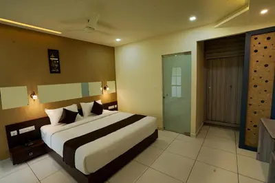a bedroom with a large bed in a room at IRON BRIDGE COVE in Meppādi