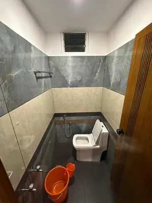 a small bathroom with a toilet and a sink at Fresh Up In Guruvayur Krishnendhu Residency in Guruvāyūr