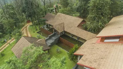 an overhead view of a house with a roof at Vythiri Mist Resort in Vythiri