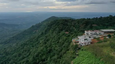 an aerial view of a house on a mountain at CHILLAX Resorts Palakkayam THATTU in Paithalmala