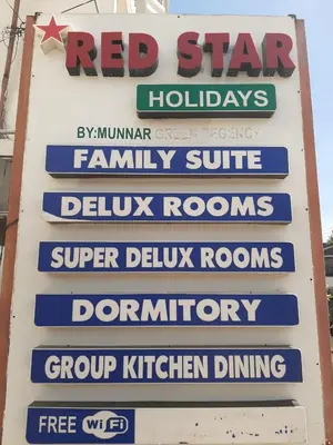a sign for a red star hudleys at Red Star Holidays in Munnar