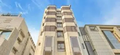 a tall building with windows on top of it at PPH Living Railotel Coimbatore in Coimbatore