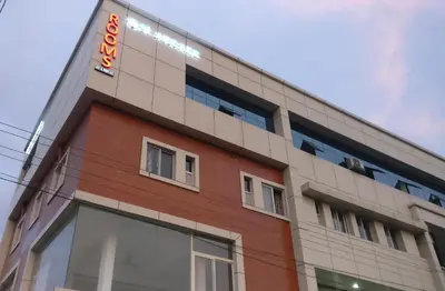 a building with a sign on the side of it at The Grand Inn in Kanjikode