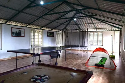 a ping pong room with a ping pong table at Avadale Wayanad - Stag Groups Not Allowed in Kalpetta