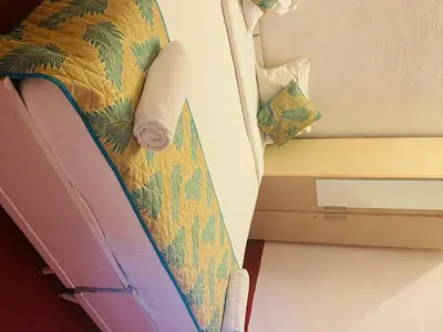 a close up of a bed in a room at Coorg Daffodil Guesthouse in Madikeri