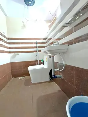 a bathroom with a sink and a toilet at QUEENS COTTAGE - individual cottage in Ooty