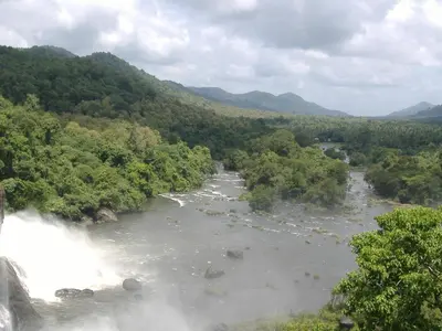 a view of a river with a waterfall at The Villa Romantica in Nedumbassery