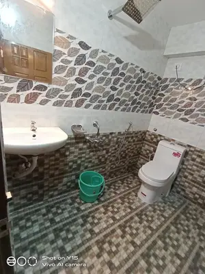 a bathroom with a sink and a toilet at Hotel Magnet in Marayoor