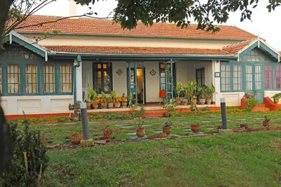 a house with plants in front of it at HS Holiday Home in Coonoor