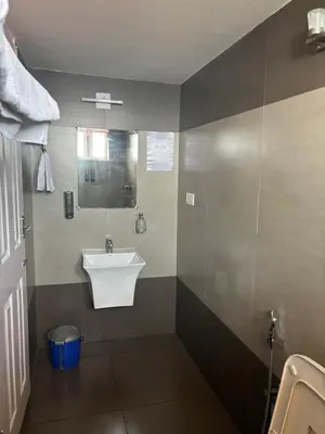 a bathroom with a sink and a mirror at Casa Felicia-Adding happy moments to your diary in Ooty