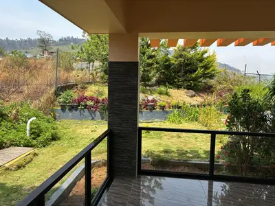 a balcony with a view of a garden at Casa Felicia-Adding happy moments to your diary in Ooty