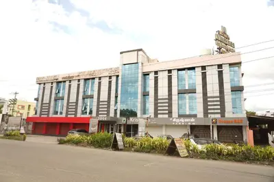 a building on the side of a street at Sri Krishnan Residency in Pollāchi