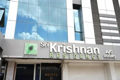 a sign on the front of a building at Sri Krishnan Residency in Pollāchi