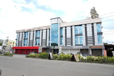 a building on the side of a street at Sri Krishnan Residency in Pollāchi