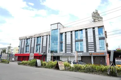 a building on the side of a street at Sri Krishnan Residency in Pollāchi
