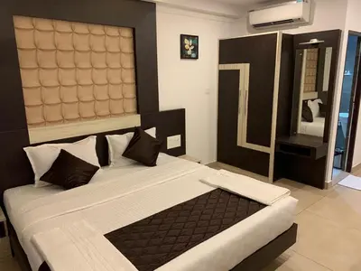 a bedroom with a large bed in a room at THE PORCH INN in Wayanad