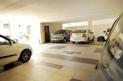 a group of parked cars parked in a garage at HOTEL THE FORTUNE in Coimbatore