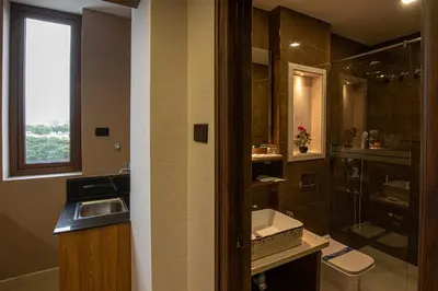 a bathroom with a sink and a shower at Windstone Residency in Coimbatore