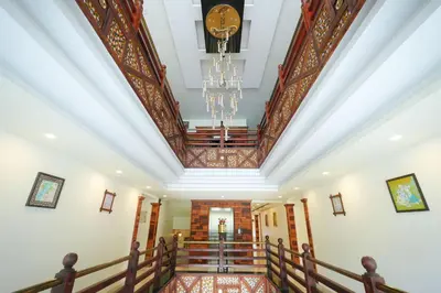 a view of the lobby of a building with a chandelier at Velan Temple View in Palani