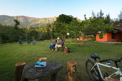 a group of people playing a game in a yard at Zostel Homes Wayanad, Thirunelly in Wayanad