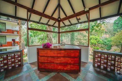 a large room with a large window at VANYA by Citrine in Nelliyampathy