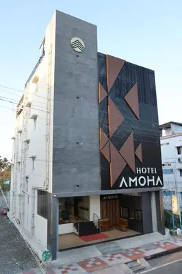a building with a hotel authority sign on it at Hotel Amoha in Palani