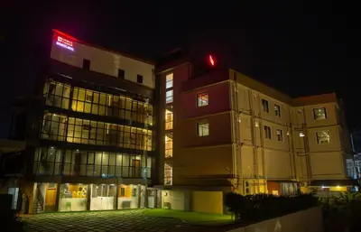 a building with a red light on top of it at Hasco Tower in Palakkad