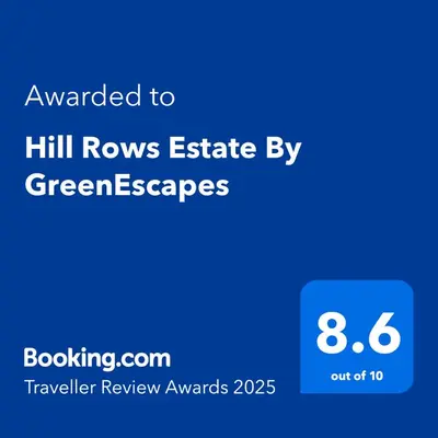 a screenshot of a cell phone with the text awarded to hill rovers estate by at Hill Rows Plantation and Forest Experience By GreenEscapes in Vythiri