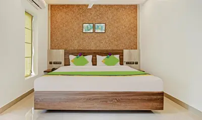 a bedroom with a large bed in a room at Sreepathi Mayoogha in Guruvāyūr