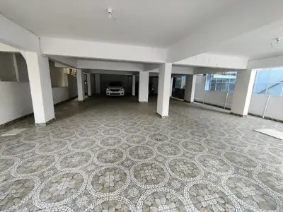 a large empty room with a large carpeted floor at Royal Wings Apartments in Mysore