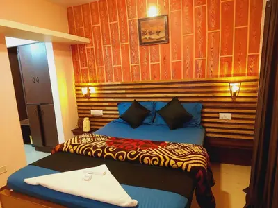 a bedroom with two beds in a room at IMPERIAL COTTAGE, HILL BUNK OOTY in Ooty
