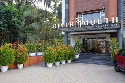 a row of potted plants in front of a building at Nexstay River Mouth International in Ferokh
