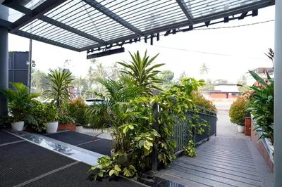 a patio with a bunch of plants at Nexstay River Mouth International in Ferokh