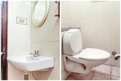 a bathroom with a toilet and a sink at Hotel O Kota Lodge in Coimbatore