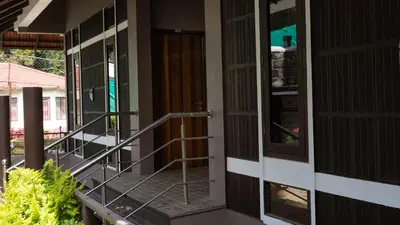 an entrance to a house with a revolving door at Radosri in Coonoor