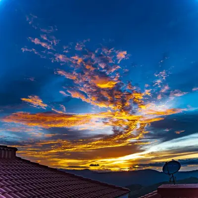a sunset from the roof of a house at Warmth Hill Crest in Kodaikānāl