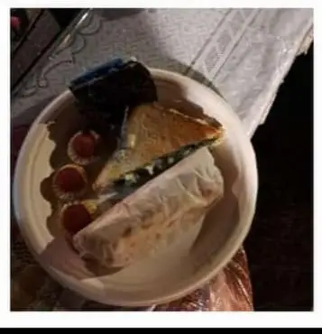 a plate with a piece of cake on top at Zeus Bungalow in Kotagiri