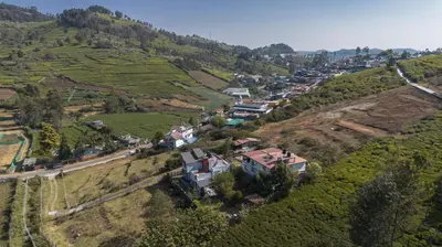 an aerial view of a village on a hill at Rendezvous in Coonoor