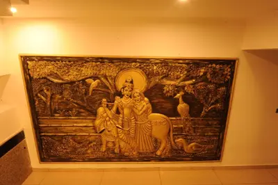 a tapestry hanging on a wall in a museum at MC Suites Mysuru in Mysore