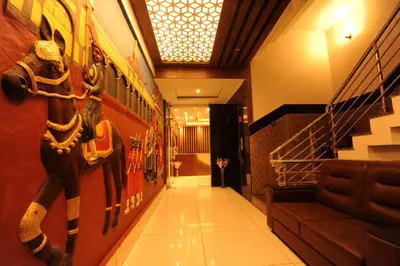a hallway with a horse painting on the wall at MC Suites Mysuru in Mysore