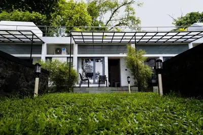 a white house with a glass roof at S RIVER RESORTS in Cochin